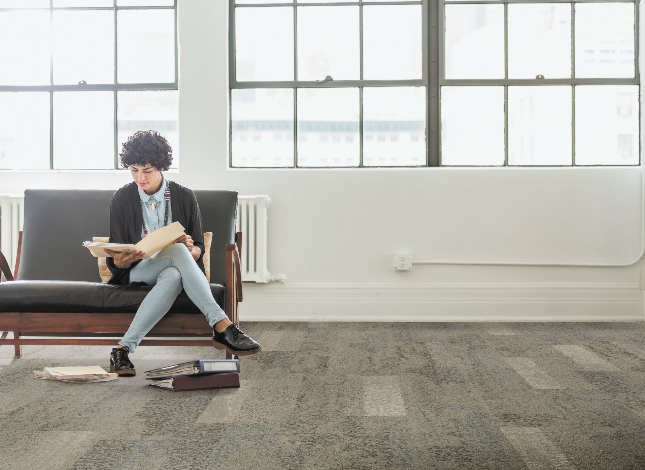 Interface Nature's Course plank carpet tile in lobby with woman sitting on bench reading a book imagen número 3